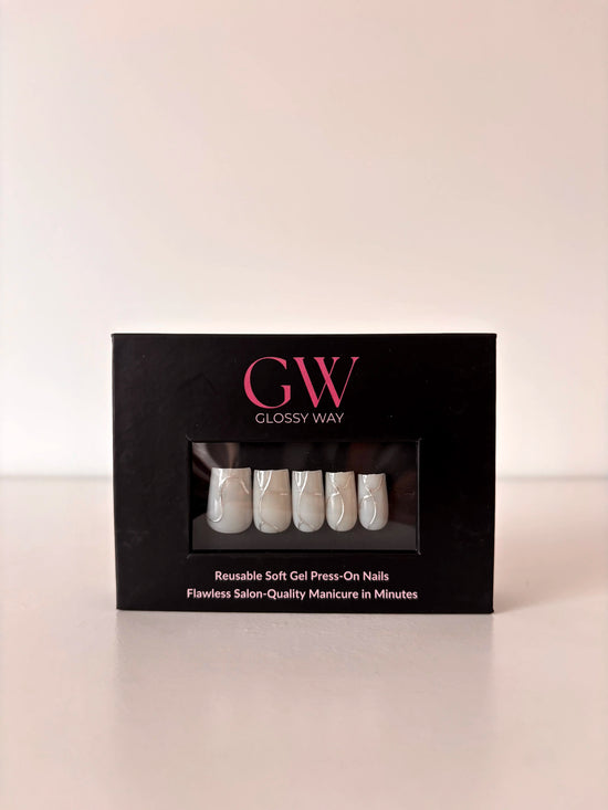 Lumière Press-On Nails made by Glossy Way inside the original package.